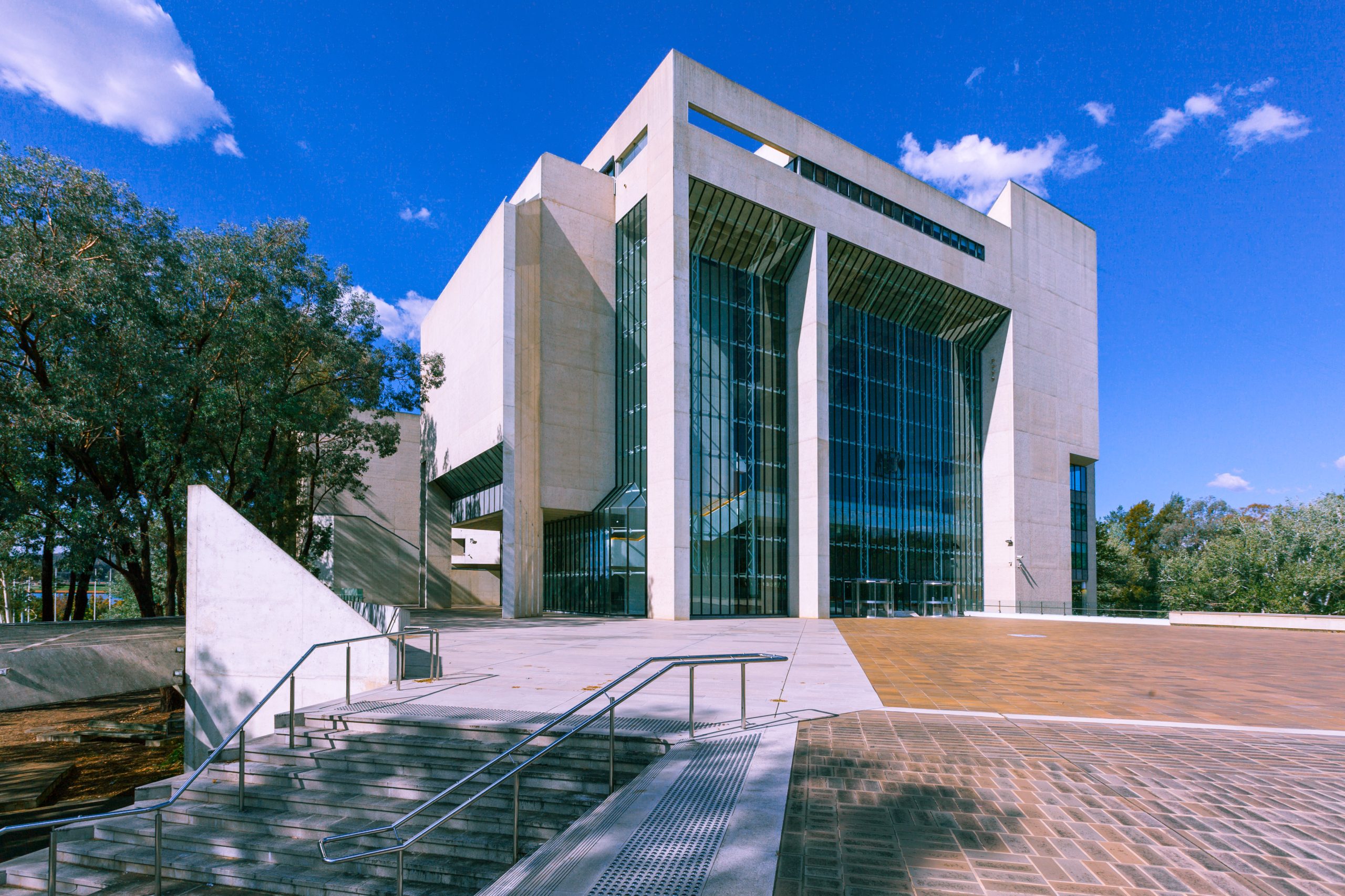 The High Court of Australia in Canberra, seen from the forecourt under a blue sky