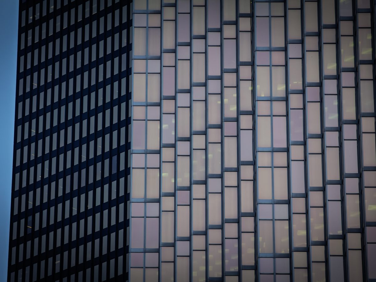 Office tower facade at dusk, glass and steel