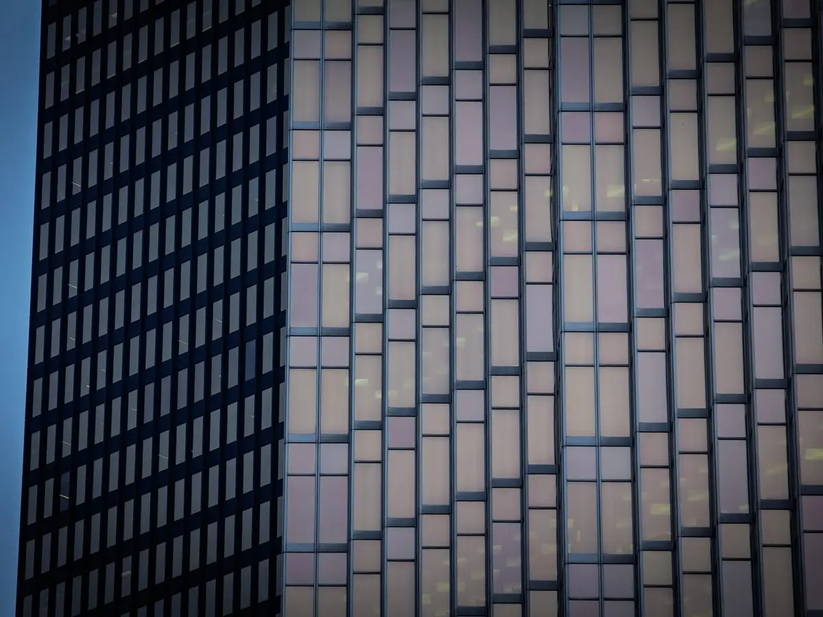 Office tower facade at dusk, glass and steel