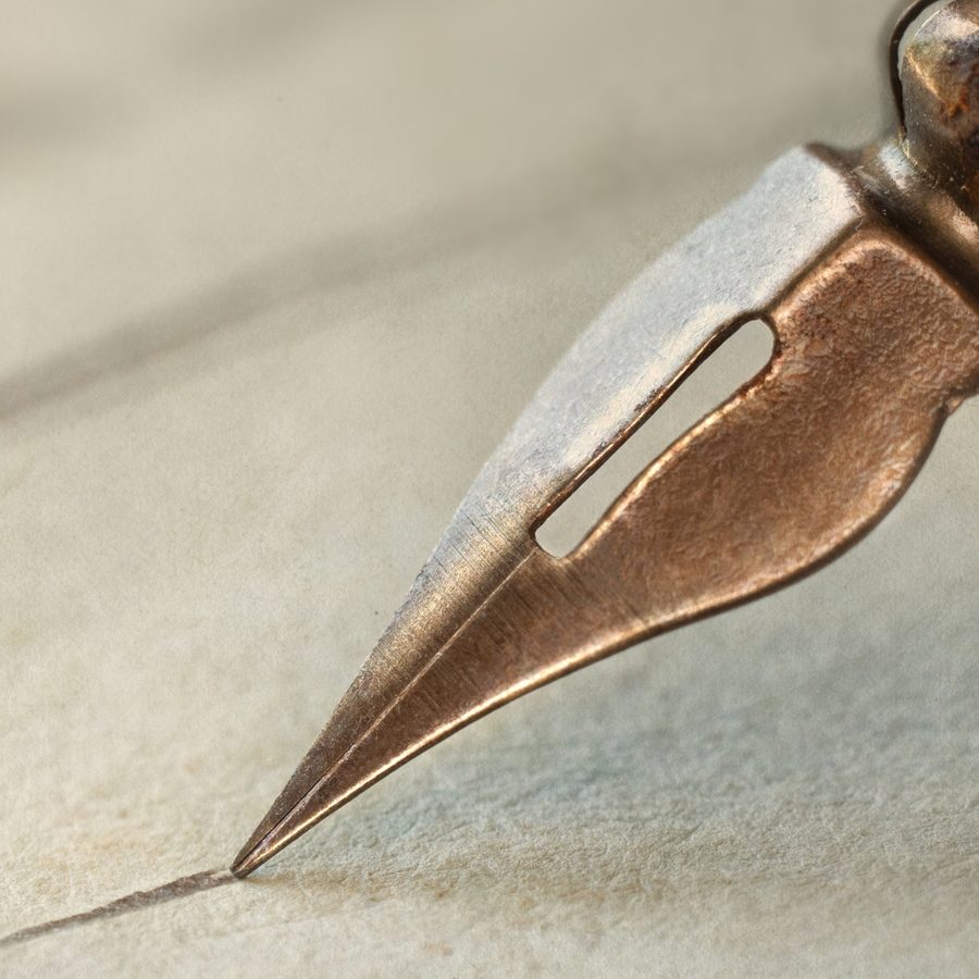 Fountain pen nib signing a handwritten document