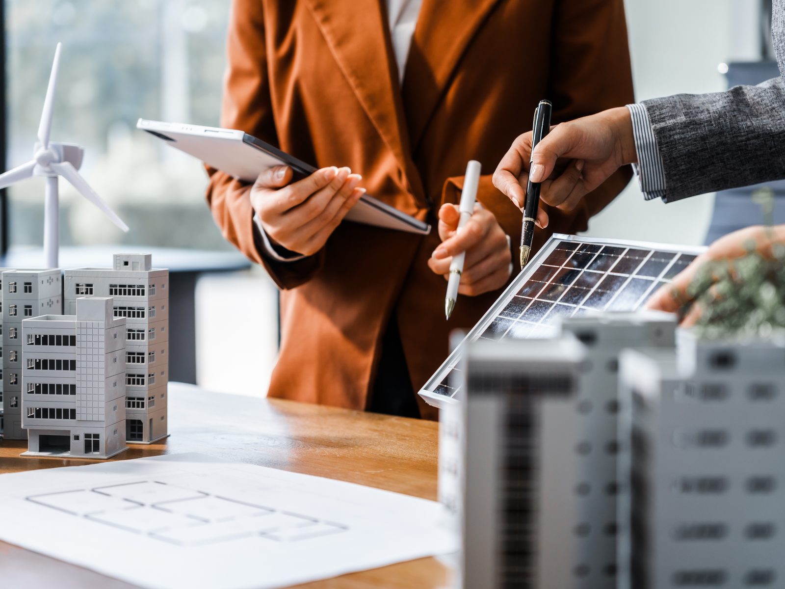 Models of wind, solar and building projects on a planning table, the industries Boettcher Law acts for