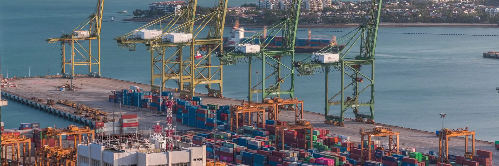 Container cranes and stacked containers at the Singapore container terminal