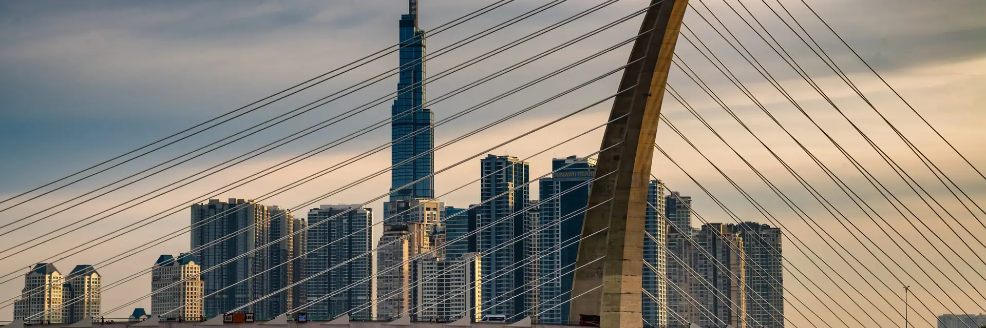 The Thu Thiem bridge cables with the Ho Chi Minh City skyline behind