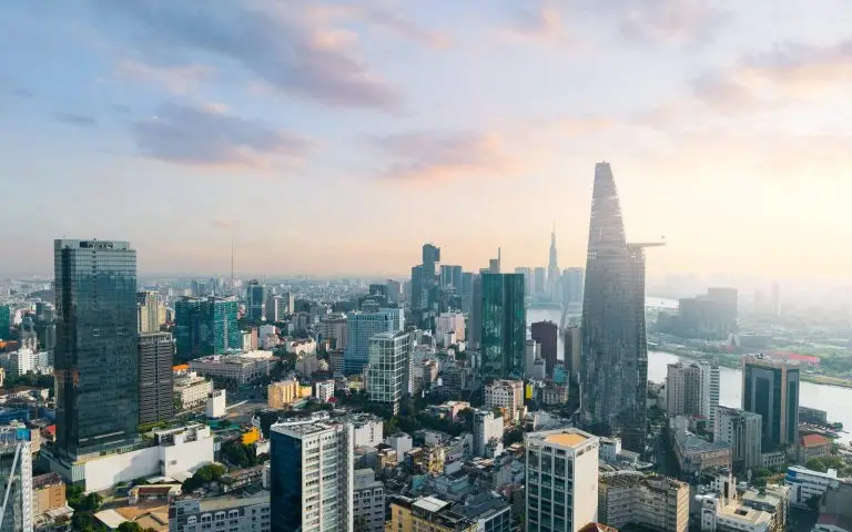 The Ho Chi Minh City skyline at dawn, looking across the central business district towards the Saigon River