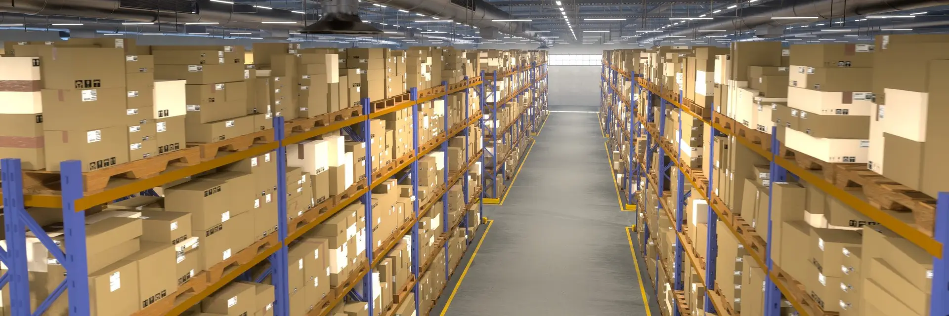 A distribution centre aisle, pallet racking stacked with cartons on both sides