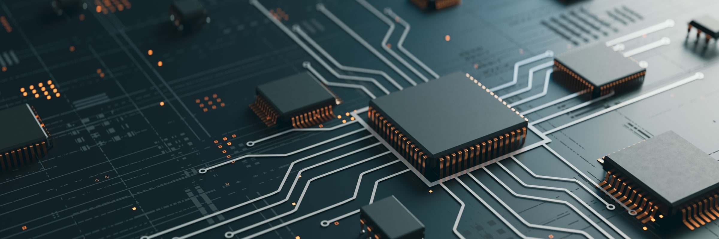 A dark circuit board with tracks radiating from a central processor