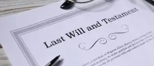 A last will and testament with reading glasses, the instrument that must carry international assets