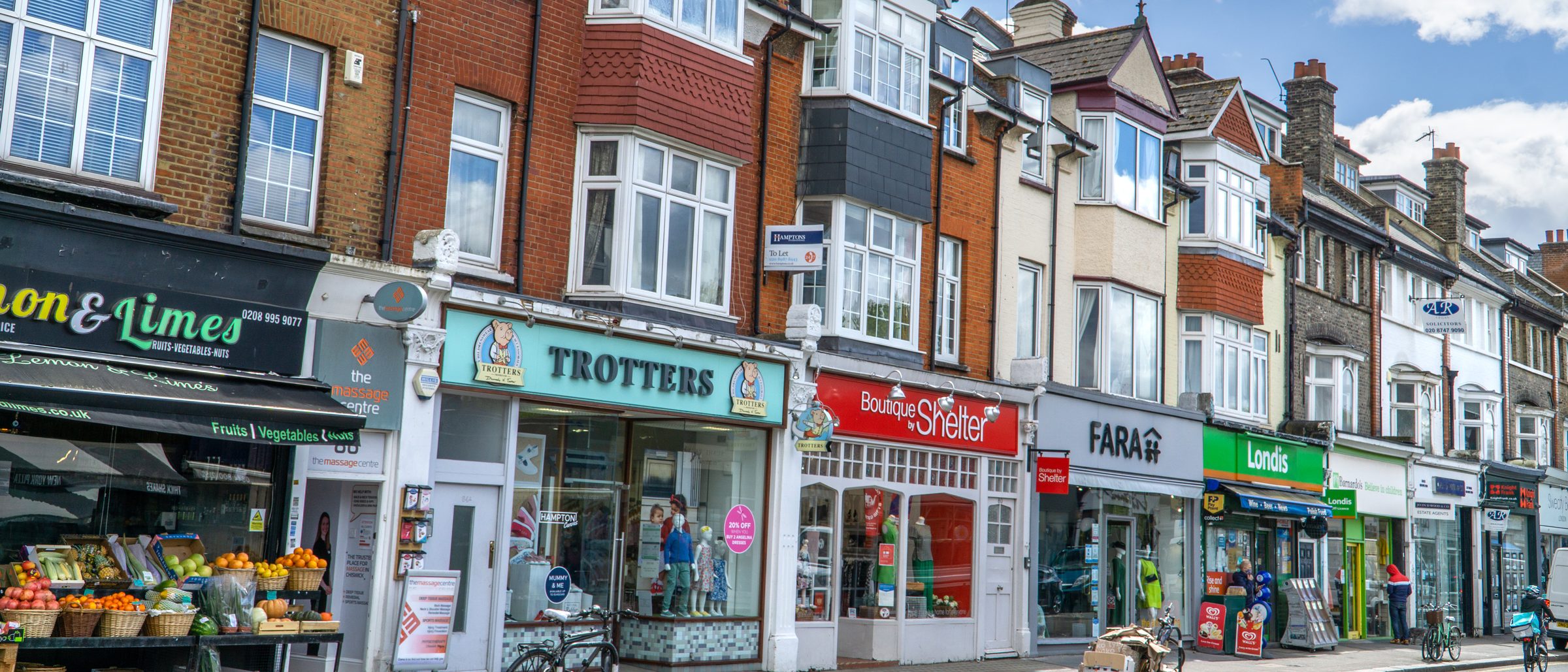 A row of small shopfronts along a suburban high street, the kind of franchised business a good faith termination dispute can end